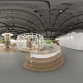 Modern Specialty Store Interior With Curved White Structures And Multiple Display Stands