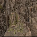 Natural Rocky Crevice Between Rugged Rock Walls With Green Moss And Scattered Stones