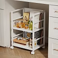 White Rolling Kitchen Shelf With Decorative Items Combination Glass Jar Books Pear On Wooden Floor