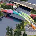 Colorful Curved Pedestrian Bridge Over River With Surrounding Greenery And Sports Courts