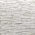 White Stone Wall Featuring Natural Textured Bricks in Modern Interior Design