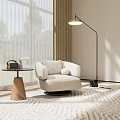 Modern Beige Armchair In Living Room With Wooden Side Table Floor Lamp And Natural Light