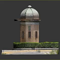 Red Brick Tower With Dome Roof And Circular Hedge On Stone Platform