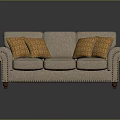 Beige Three Seat Sofa with Orange Geometric Pattern Cushions Nailhead Trim and Wooden Legs