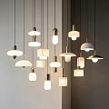Modern Pendant Lights With Various Designs Metallic Frames And Warm Lighting In Indoor Space