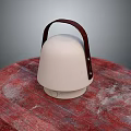 White Furniture Container With Brown Leather Handle On Red Wooden Surface