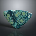 Triangular Teal Green Stone Decorative Piece With Circular Patterns And Natural Texture