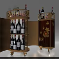 Elegant Round Wheeled Wine Cabinet With Open Doors Red Wine Bottles Glassware And Decorative Flowers