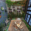 Outdoor Feature Wall With Blue Surface Fish Decorations Green Plant Wall Wooden Deck Orange Umbrella