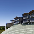 Modern Hillside Hotel Building Featuring Angular Roof Multi Level Structure And Glass Terrace 3d model