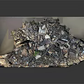 Layered Waste Debris Model Showing Various Fragments And Small Green Plants