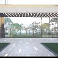 Elegant Modern Residential Entrance Featuring Grille Design Gate And Pedestrian Plaza With High Rise Buildings