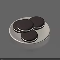 Delicious Dark Chocolate Cookies Filled With White Cream On A White Plate