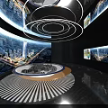 Modern Exhibition Hall Interior With Circular Display Table Cityscape Screens And Circular Lighting