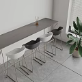 Modern Bar Counter With Gray Top Metal Legs Black White Chairs Near Window Potted Plant