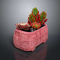 Colorful Succulent Plants In Pink Bus Shaped Planter With Green Red Leaves