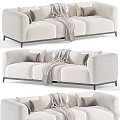 Elegant Modern Sofa In Neutral Colors With Decorative Pillows And Cozy Throw Blanket