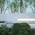 Modern Landscape Wall Design With Marble Surface And Surrounding Green Plants And Trees