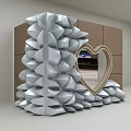 Silver Event Entrance With Petal Shaped Protrusions Heart Shaped Mirror Wooden Frame And Brown Cabinets