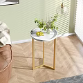 Round Modern Side Table with White Tabletop Black Metal Legs Vase Green Plants and Lemons
