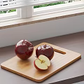 Red Apples And Sliced Apple On Wooden Cutting Board Near Window