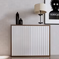 Modern Storage Cabinet with White Doors Brown Frame Table Lamp Vases and Wall Art