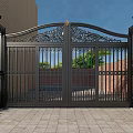 Ornate Wrought Iron Gate With Decorative Design And Lamp Posts Brick Wall Greenery