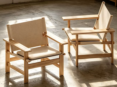 Minimalist Wooden Armchairs With Light Colored Cushions In Natural Light Indoor Setting 3d model