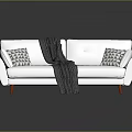 Modern Minimalist White Sofa With Geometric Pattern Pillows Dark Striped Blanket And Red Legs