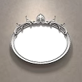 Elegant Oval Bedroom Mirror With Golden Decorative Frame Reflecting Bed And Pillows