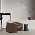 Modern Beige Leisure Chair with Green Side Stool and Artwork in Minimalist Interior