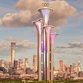 Illuminated Landscape Sculpture With Three Towers Olympic Rings And City Water Reflection