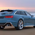 Blue Audi Wagon With Beach Sunset Background And Sporty Exterior Design