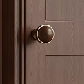 Wooden Door Knob With Brass Rim On Dark Wood Grain Door Panel