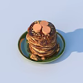Delicious Stack of Pancakes with Orange Toppings and Nuts on Green Plate