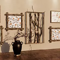 Elegant Wall Decor Featuring Decorative Frames With Floral Branch Patterns And Black Vase On Table 3d model