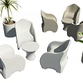 Modern Curved Leisure Chairs Featuring Simple Design Round Side Tables And Green Plants