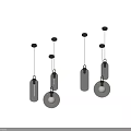 Modern Glass Pendant Lights With Metal Accents And Globe Bulbs Hanging