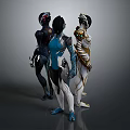 Three Futuristic Female Sculptures With Elaborate Metallic Costumes And Shiny Details