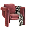 Cozy Red Fabric Accent Chair With Black And White Geometric Pattern Blanket