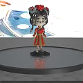 Cute Doll With Black Hair In Braids Red Outfit And Golden Decorations Against Blue Sky