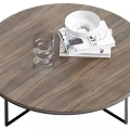 Round Wooden Coffee Table With Black Metal Legs Clear Glass Cups Magazines And White Bowl