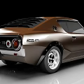 Brown Vintage Sports Car With Streamlined Body And Silver Alloy Wheels