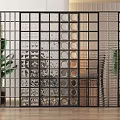 Black Frame Room Divider With Clear Textured And Circular Dot Glass Panels And Indoor Plants
