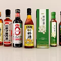 Various Chinese Condiment Bottles Including Soy Sauce Cooking Wine And Oils For Kitchen Use