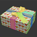 Decorative Gift Box With Colorful Heart Patterns And Golden Bow Wrapping Paper