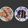 Colorful Cake Rolls And Mini Pastries On Two Plates With Fruit Decorations 3d model