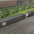 Modern Black Landscape Seat With Curved Design Along Green Plants And Stone Pavement