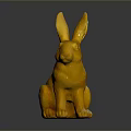 Golden Rabbit Statue In Sitting Position With Shiny Metallic Finish Against Dark Background