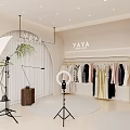 Modern Public Office Space with YAYA Logo Clothes on Hangers Ring Light and Green Plants